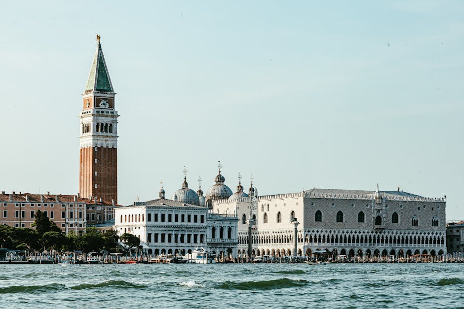 Scenic view of St. Mark's Campanile and Doge's Palace from the water in Venice, Italy.